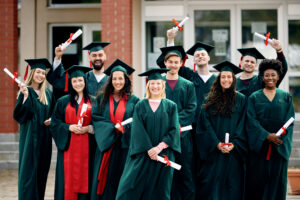 Group of new grads smiling.