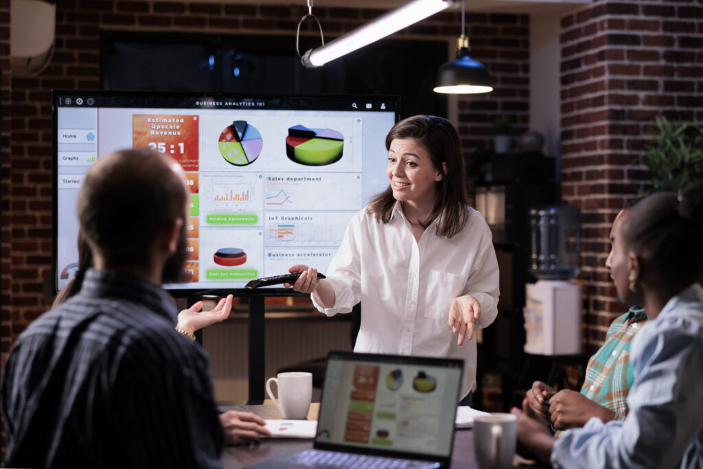 A team having a meeting about campaign optimization.