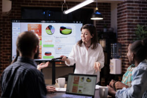 A team having a meeting about campaign optimization.