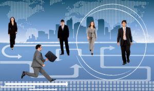 A group of business professionals walks across a directional paths and arrows, symbolizing career map.